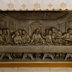 Close-up view of a detailed Last Supper metal relief sculpture, symbolizing a famed biblical scene.